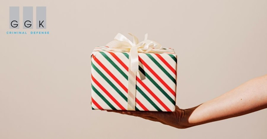 person holding a holiday gift