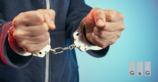 person on handcuffs